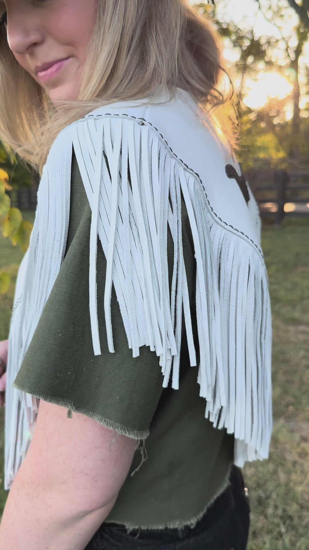 Video of woman in white cape